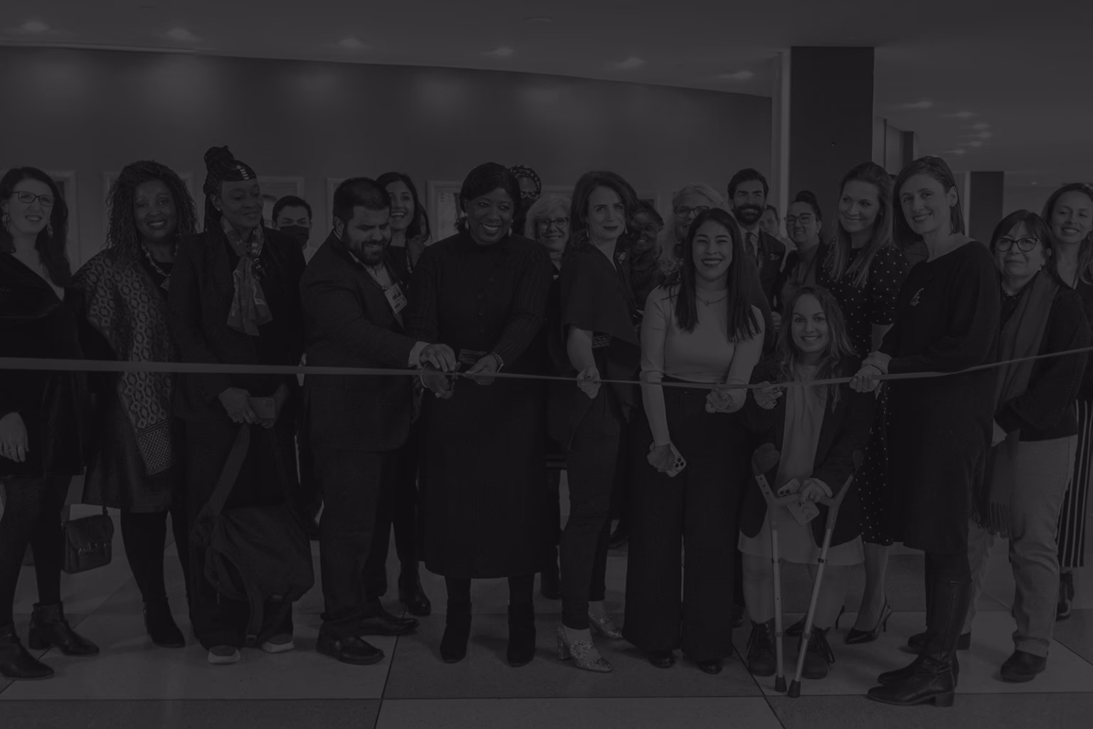 Network members cutting a ribbon at a United Nations exhibition